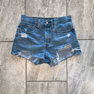 Levi's Women's 501 Light Blue Frayed Denim
Shorts in Medium Indigo
